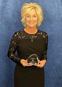 Beth Justice with award